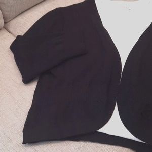 Shrug. Open front lightweight sweater with waist detailing for shape.